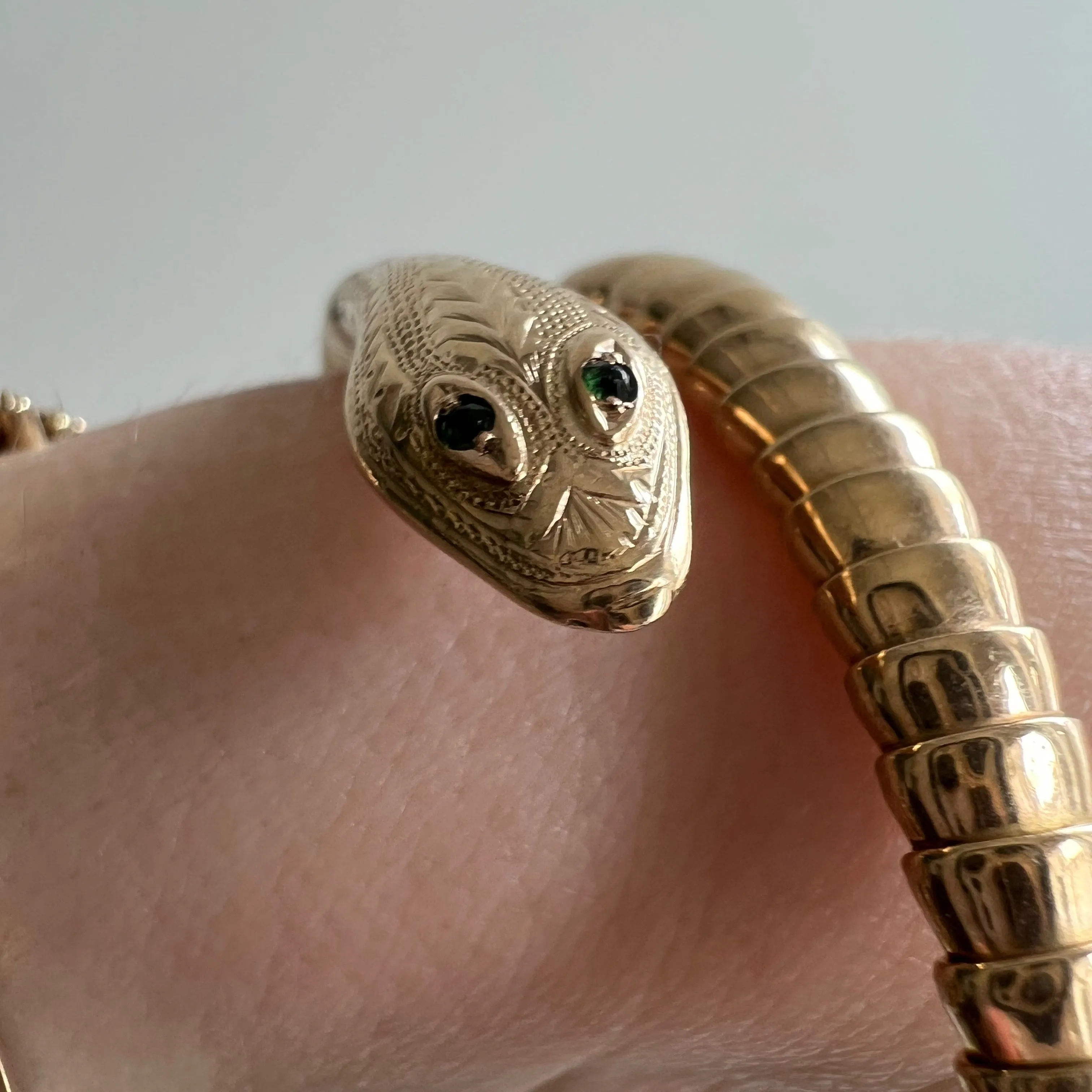 V I N T A G E // wrist protector / 9k yellow gold and emerald wrap around snake bangle / a bracelet